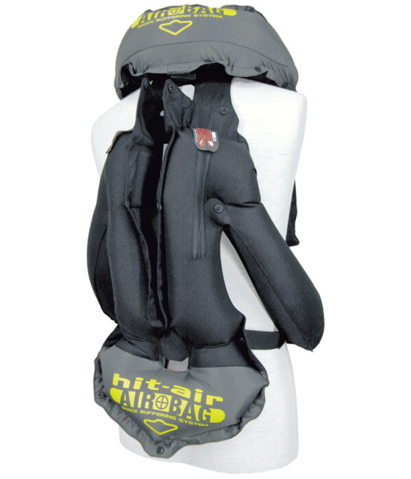 A person wearing a back pack with a helmet on it.