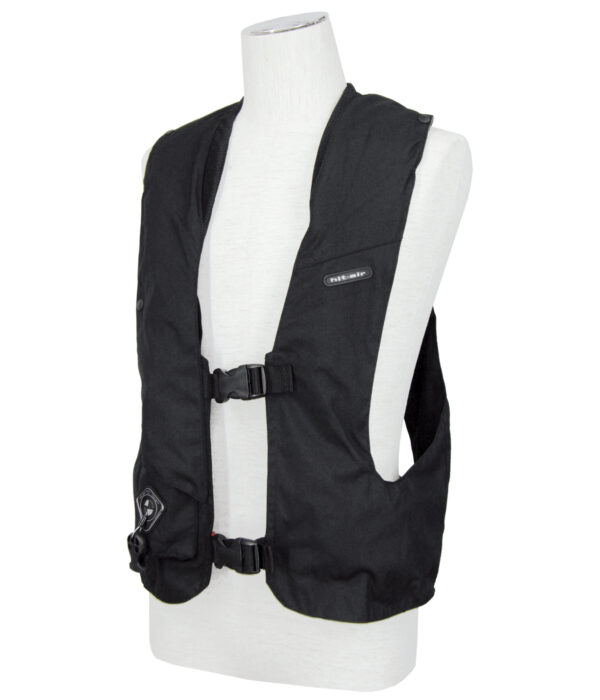 A black vest is on a mannequin.